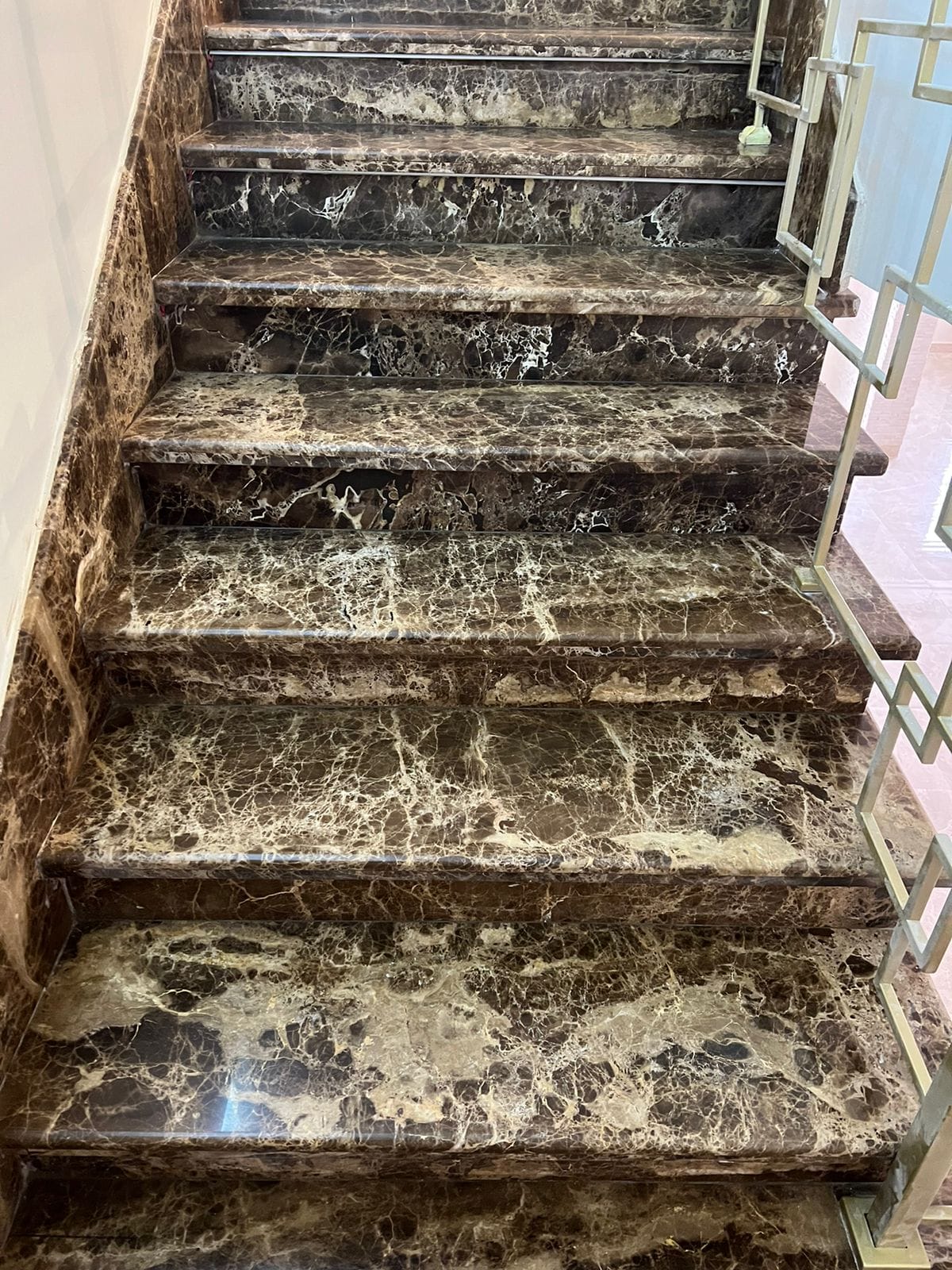 Staircase in dark veined marble